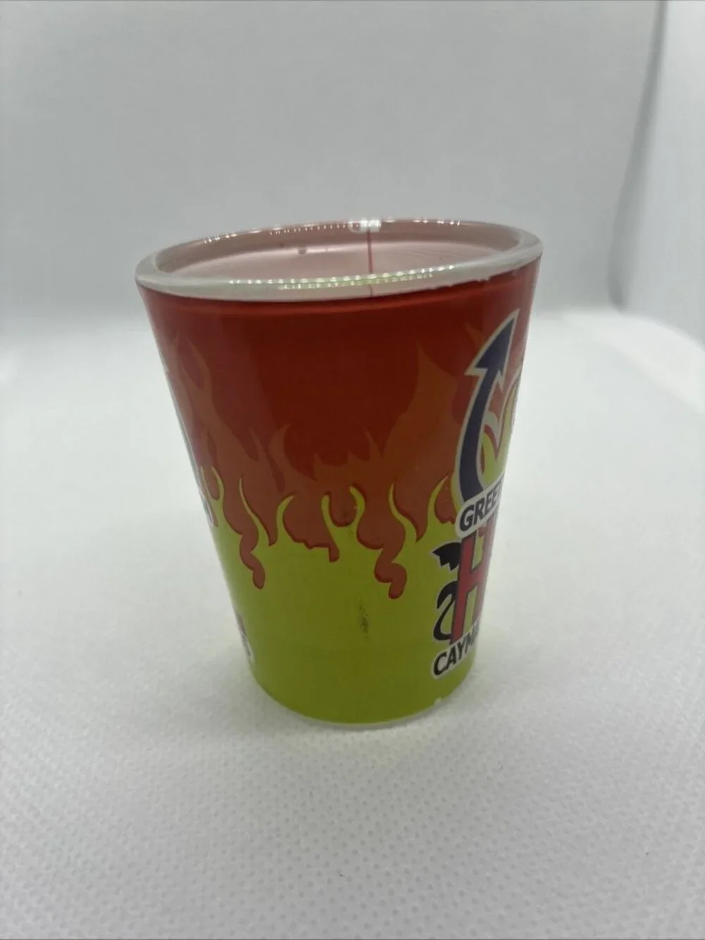 Vintage Greetings From Hell Cayman Islands Shot Glass Souvenir Red Green Flames
